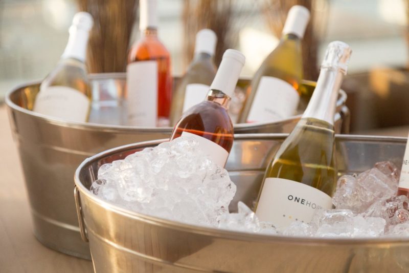 wine bottles in ice buckets
